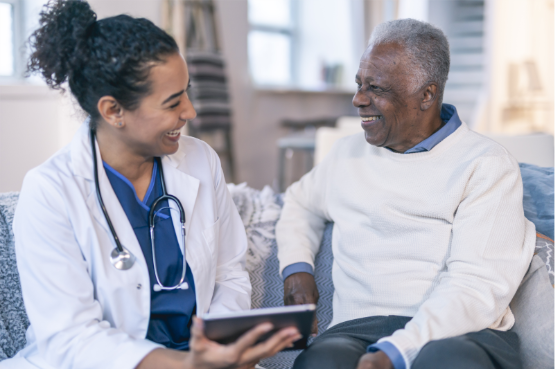 A clinician and a patient reviewing information together on a tablet